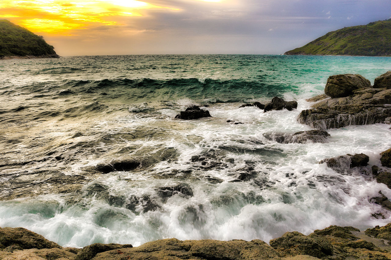 sea, water, wave, horizon over water, surf, scenics, beauty in nature, motion, sky, beach, rock - object, nature, shore, tranquil scene, tranquility, idyllic, rock formation, splashing, cloud - sky, power in nature