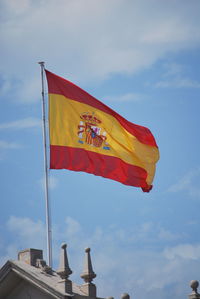 Low angle view of flag against sky