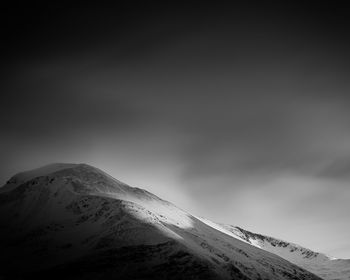 Scenic view of snowcapped mountain against sky