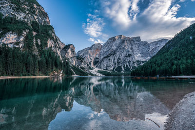 Scenic view of lake and mountains against sky