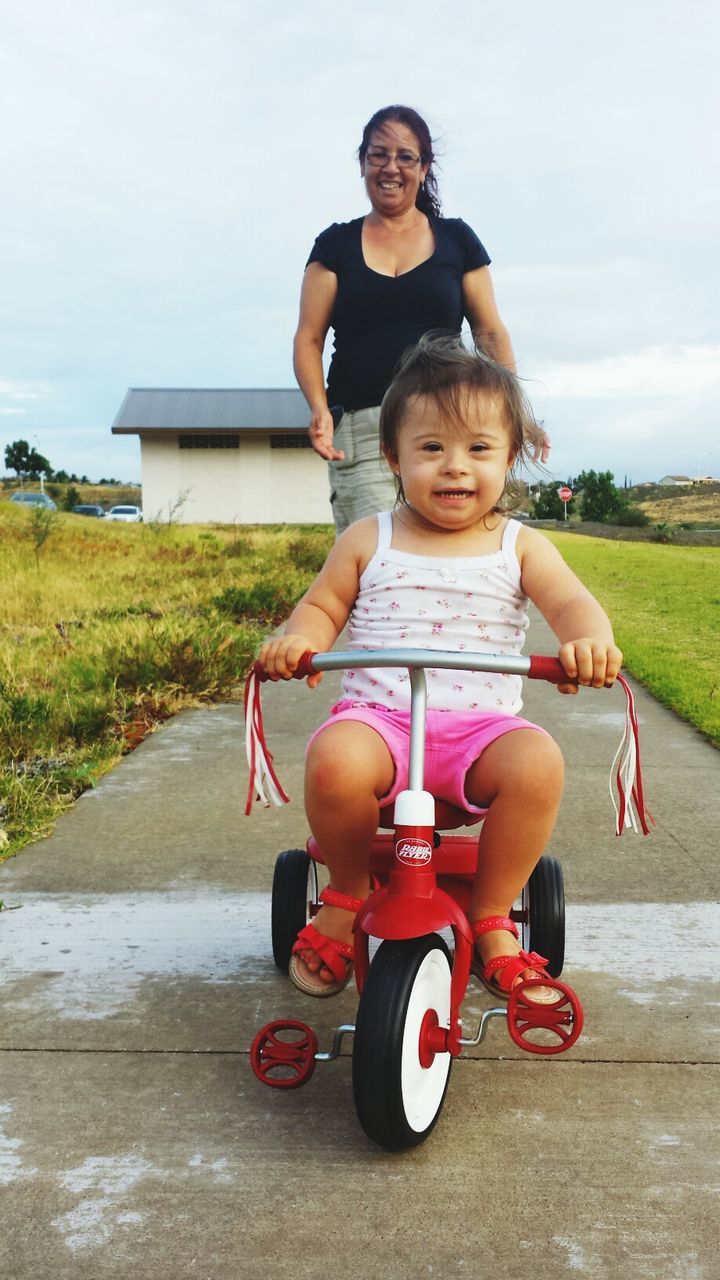 person, childhood, lifestyles, full length, leisure activity, elementary age, casual clothing, smiling, girls, happiness, portrait, looking at camera, young adult, fun, boys, cute, innocence, sky