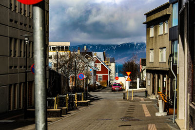 Street amidst buildings against sky