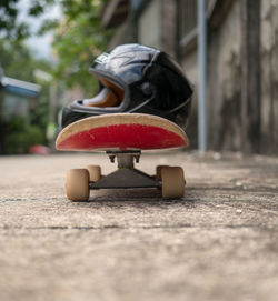 Close-up of skateboard on street