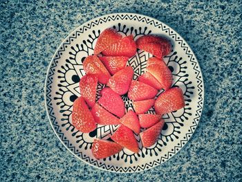 High angle view of strawberries in plate on table