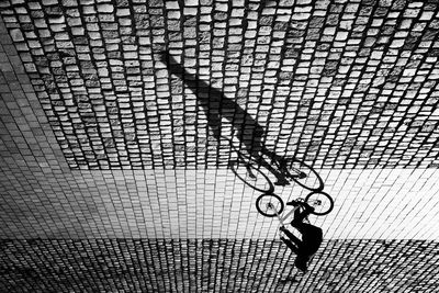 Woman standing on footpath