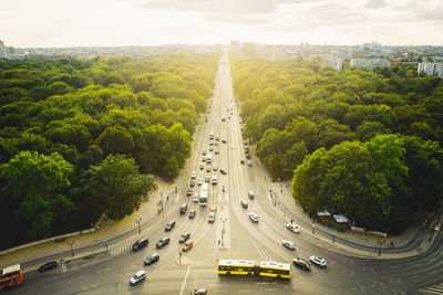 High angle view of highway amidst trees in city