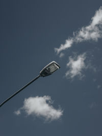 Low angle view of street light against sky
