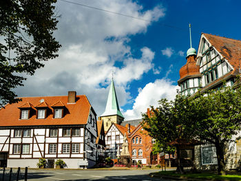 Houses against sky in city