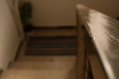 Close-up of open book on table at home