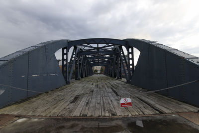 View of bridge against cloudy sky