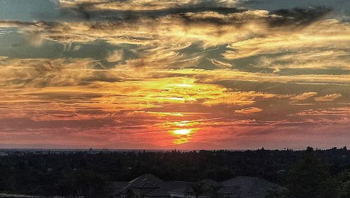 Scenic view of dramatic sky during sunset