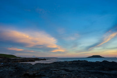 Scenic view of sea against sky during sunset