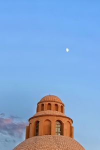 Low angle view of building against blue sky