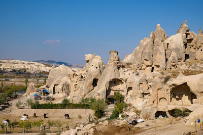 Panoramic view of rock formations against sky