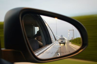 Reflection of car on road