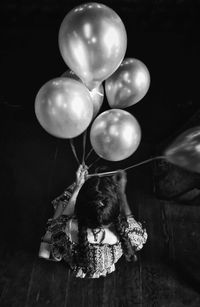 High angle view of girl sitting on floor