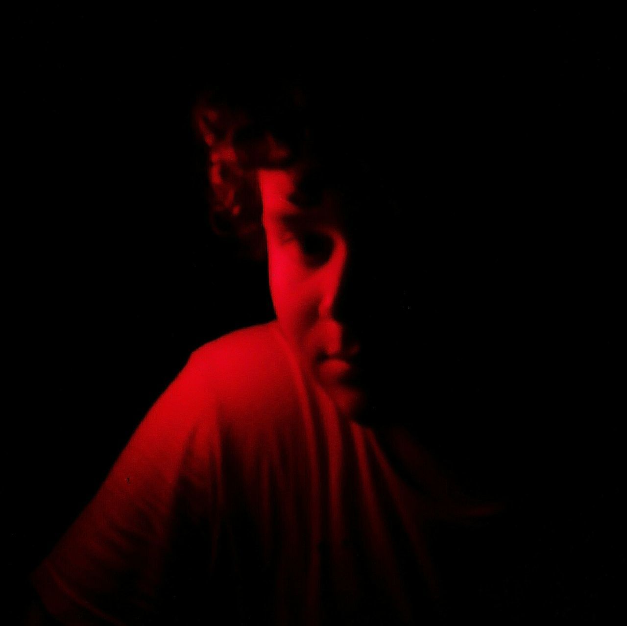 black background, studio shot, indoors, one person, red, headshot, portrait, copy space, close-up, front view, looking, dark, domestic room, young adult, looking away, light - natural phenomenon, cut out, lifestyles, contemplation, human face