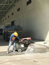 Man working on street in city