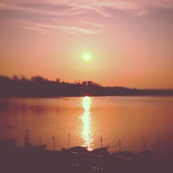 Scenic view of lake at sunset