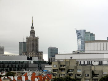 Skyscrapers in city against clear sky