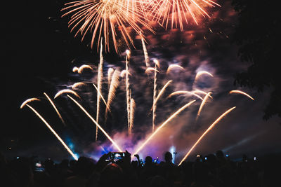 Firework display at night