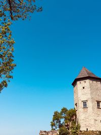 Low angle view of building against clear blue sky