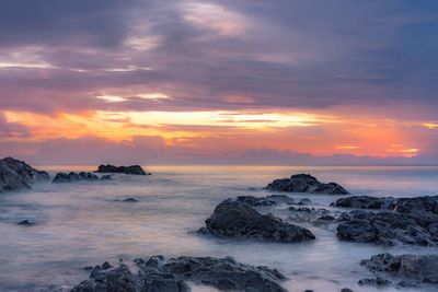 Scenic view of sea against sky during sunset