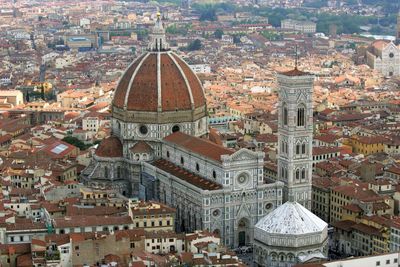 Aerial view of cathedral of santa maria del fiore amidst buildings in city