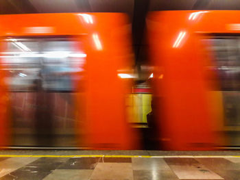 Blurred motion of train at railroad station platform