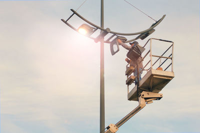 Low angle view of basketball hoop against sky