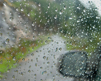 Full frame shot of raindrops on glass window