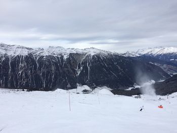 Scenic view of snowcapped mountains against sky