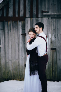 Full length of couple standing outdoors