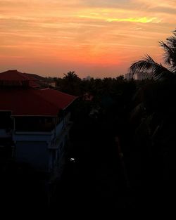 Silhouette trees against sky during sunset