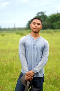 Young man standing on field
