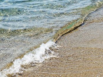 High angle view of waves rushing towards shore