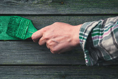 Close-up of man hand on table