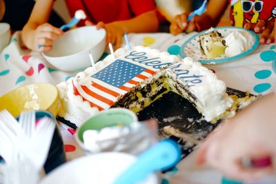 Kids eating american flag cake at party