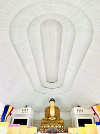 Low angle view of statue against ceiling