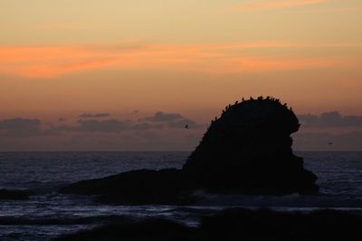 Scenic view of sea against dramatic sky