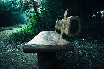 Old abandoned truck on field in forest