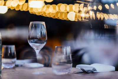 Luxury table settings for fine dining with and glassware, pouring wine to glass.beautiful background