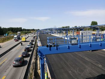 High angle view of vehicles on road against sky