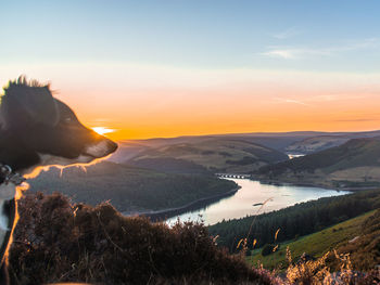 Scenic view of landscape against sky during sunset