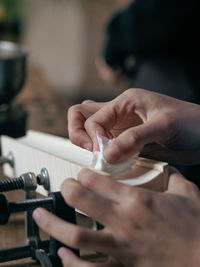 Cropped hand of carpenter at work