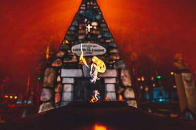 Close-up of statue in illuminated temple