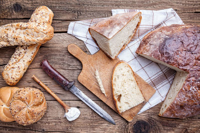 High angle view of bread on cutting board