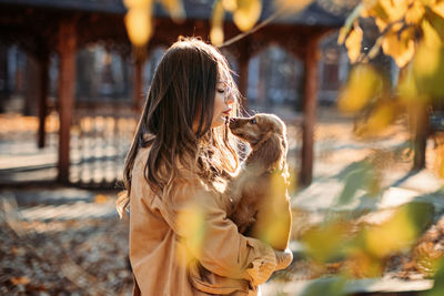 Improving dogs immune system. boost puppy immune system. happy woman walking with cocker spaniel