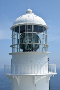 Built structure by sea against sky