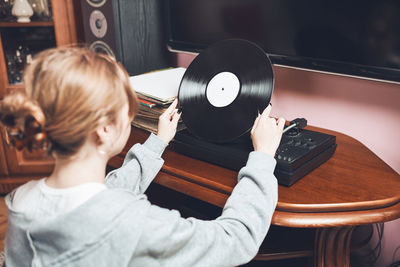 Playing music from vinyl record. analog disc. retro music. vintage style. stereo set. playing music